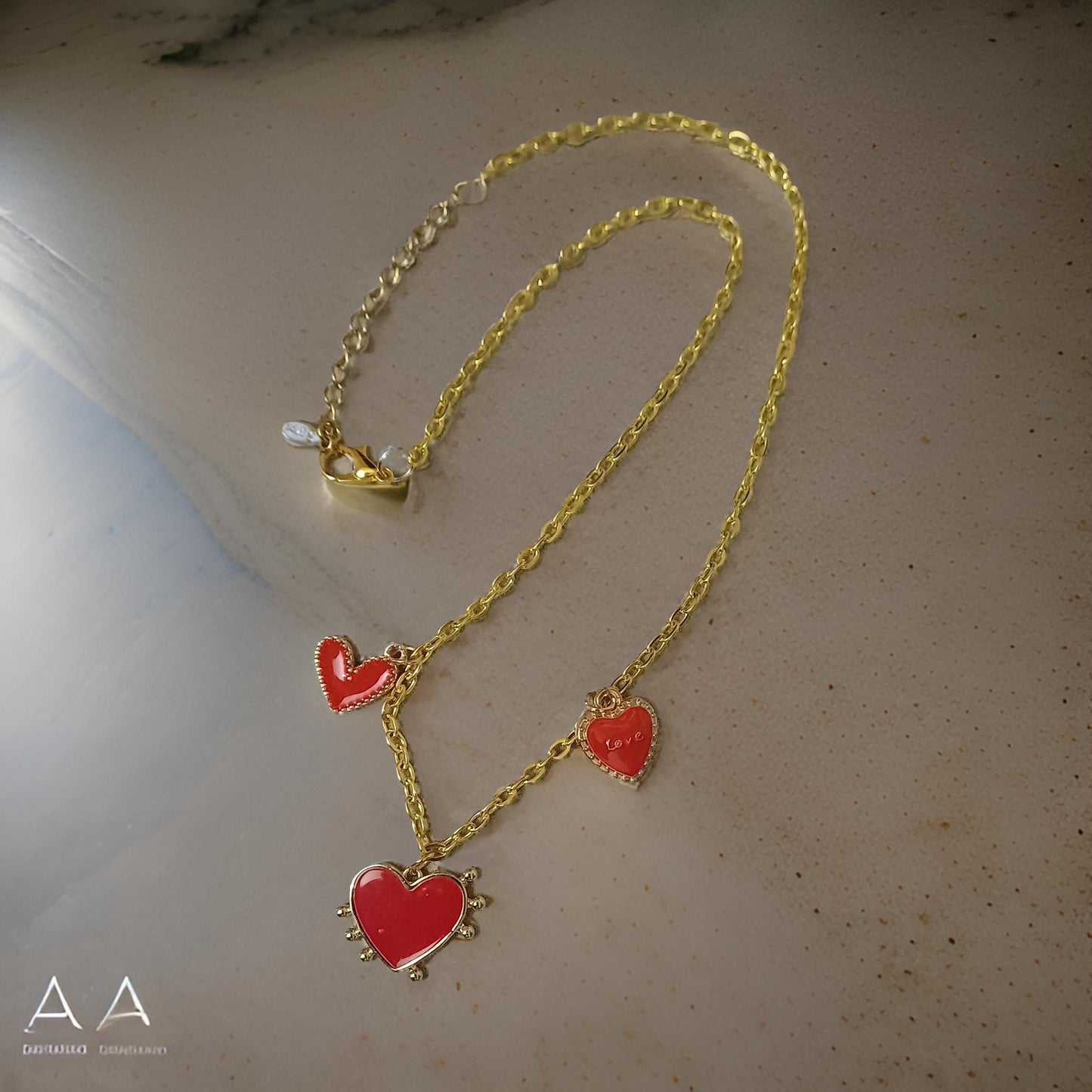 Collier amour trio coeurs rouges